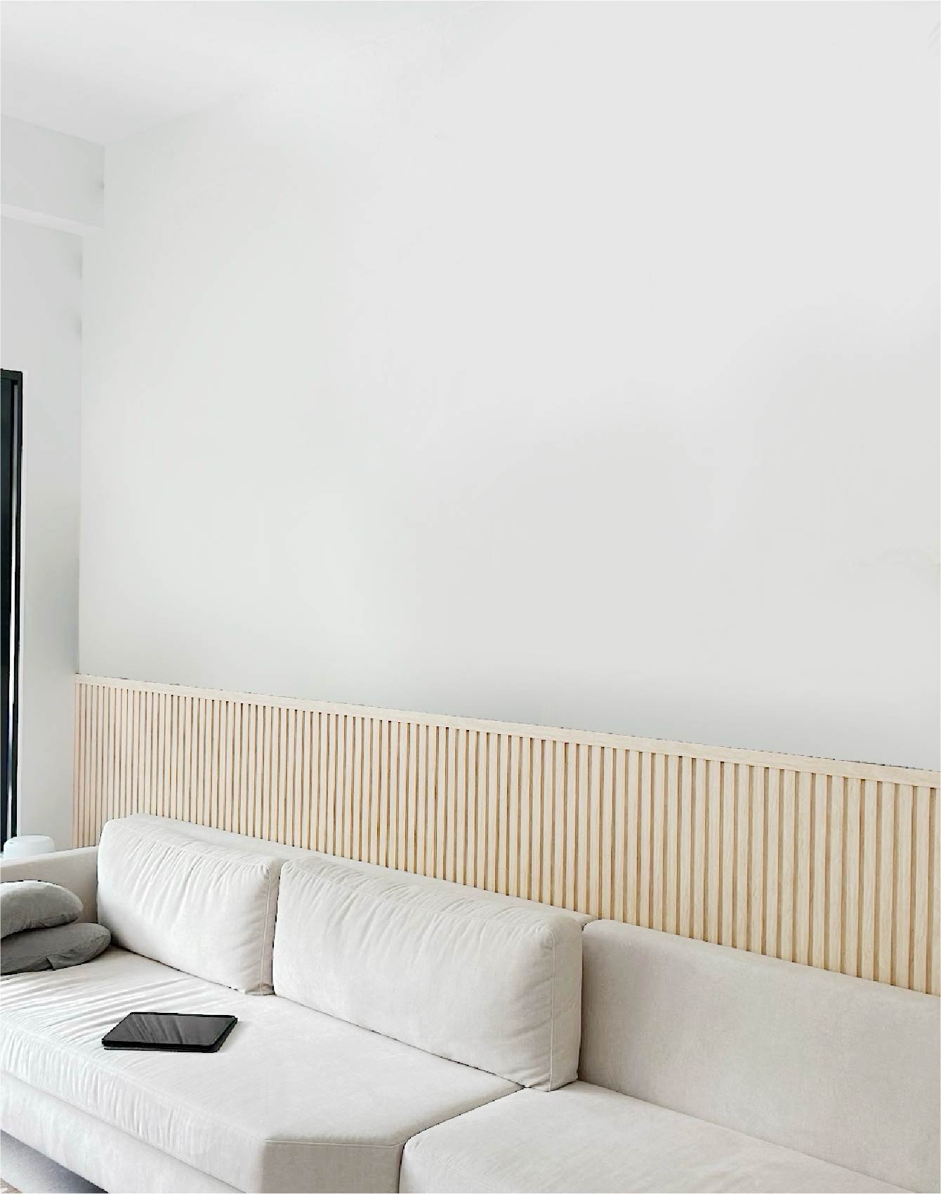  a side of living room with a bland wall